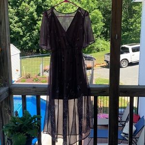 A dark purple and floral print summer dress.